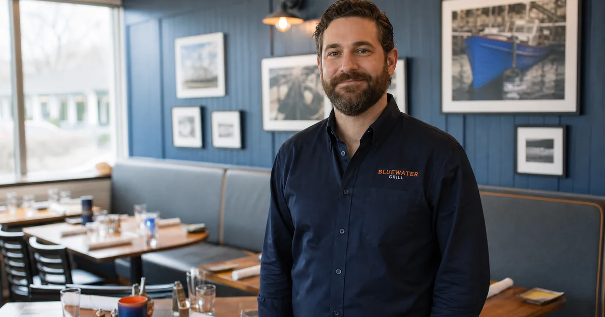 A confident restaurant owner in their dining room