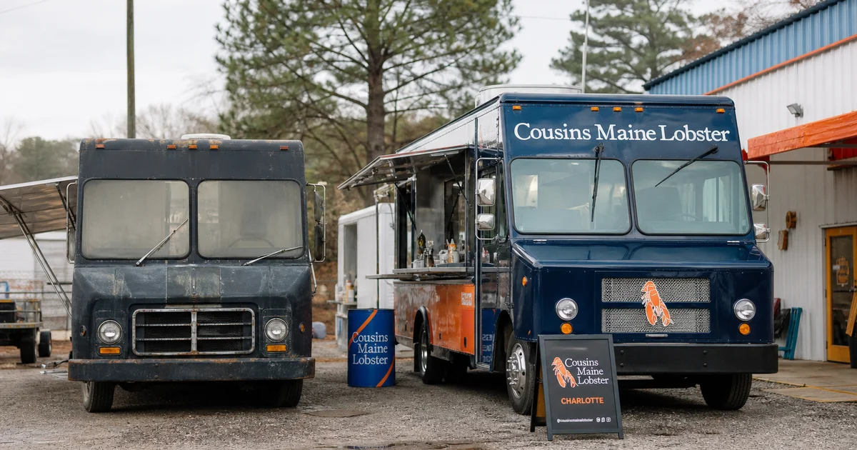 A new food truck beside an older used unit in a NC parking lot